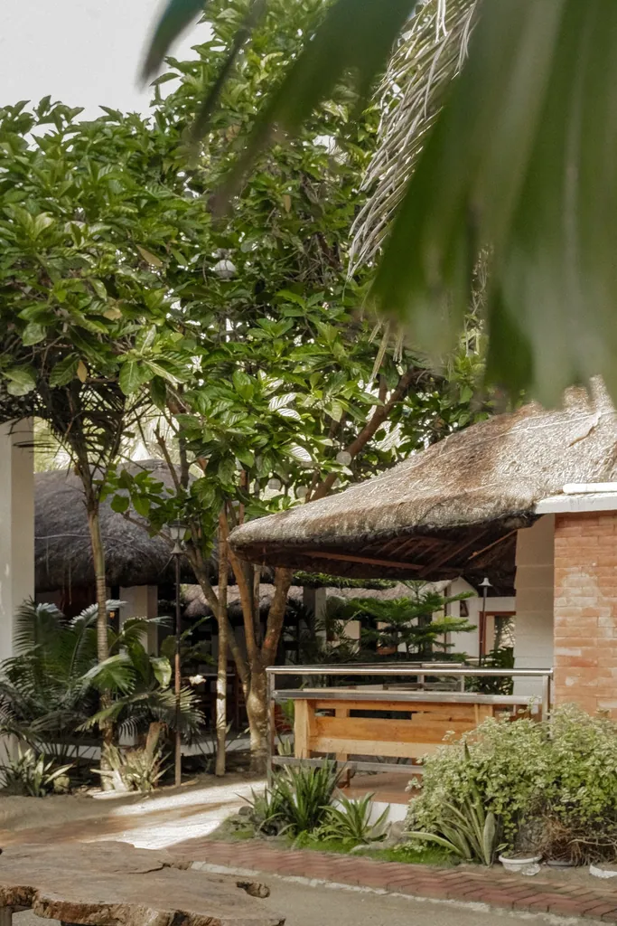 Tropical gardens and resort buildings at Charlina’s Beach House